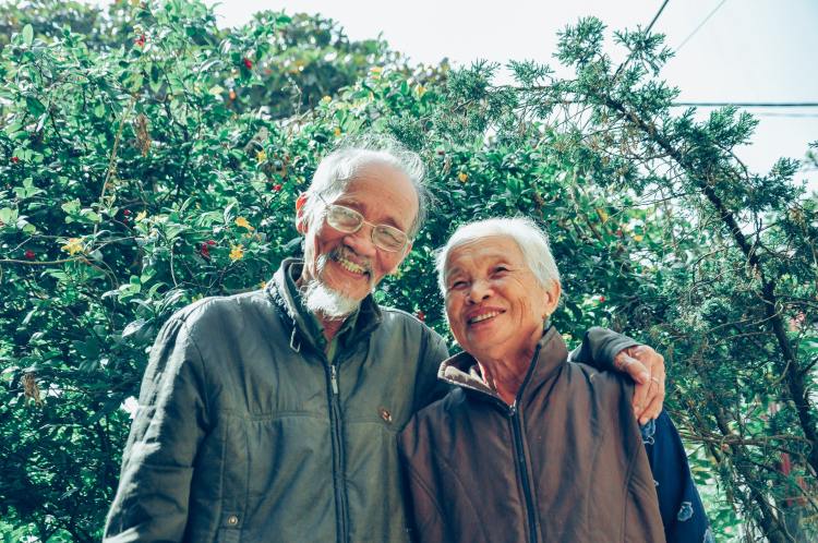 senior asian couple smiling medicare advantage